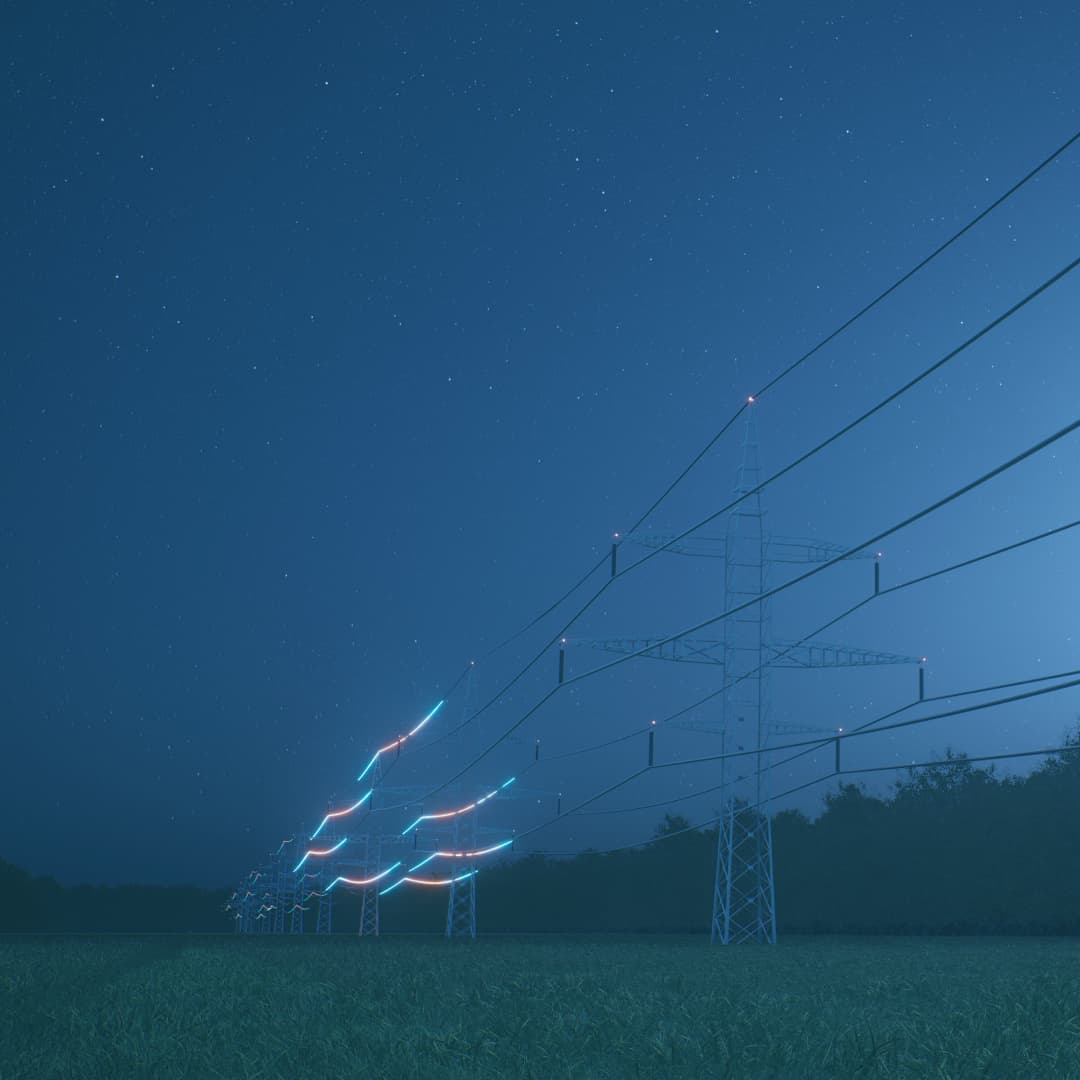Large pylons at night with glowing wires
