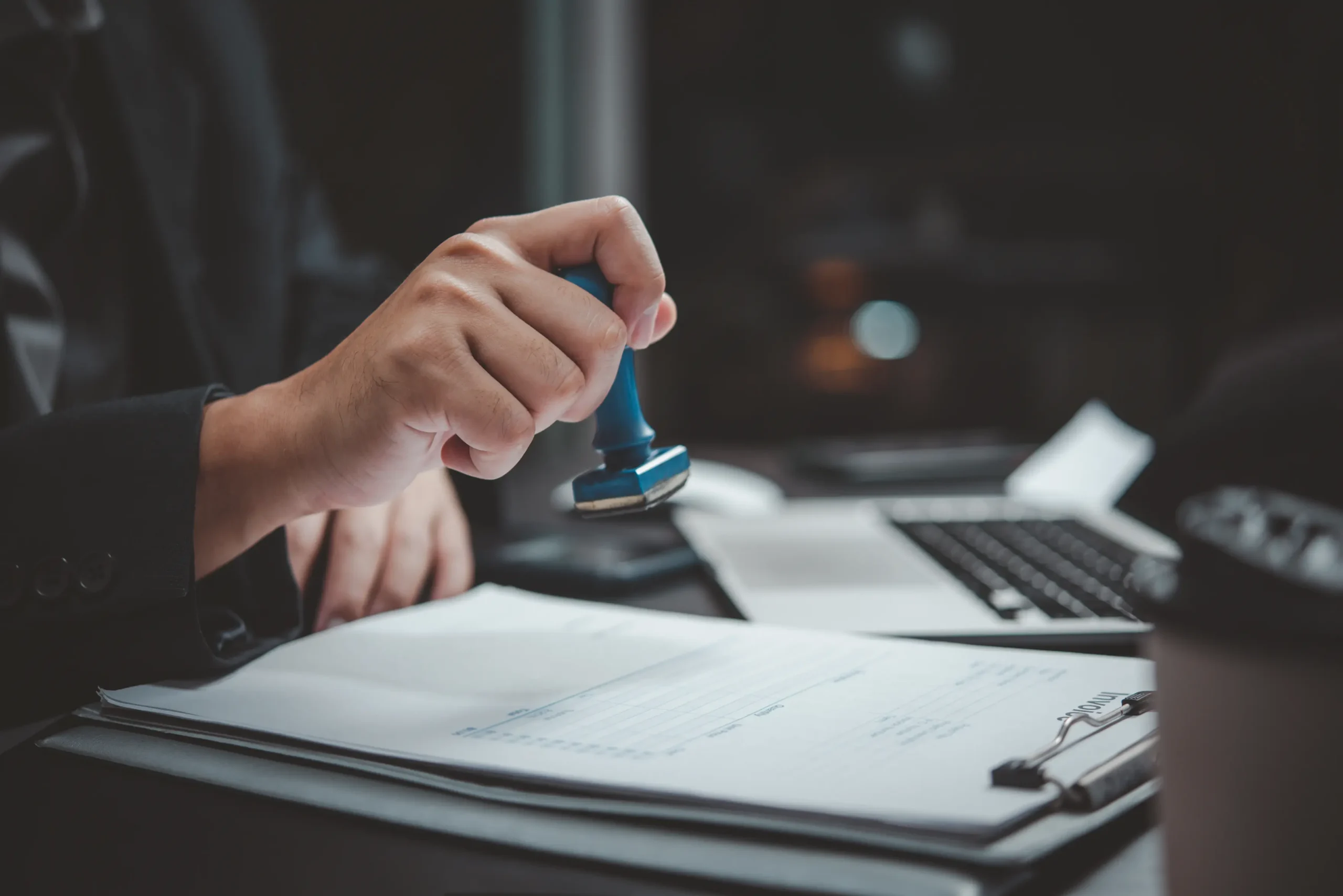 hand-hold-stamping-rubber-business-document-invoic-2026-03-19-23-08-18-utc